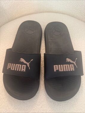 Puma Women’s Black Slides with Metallic Rose Accent